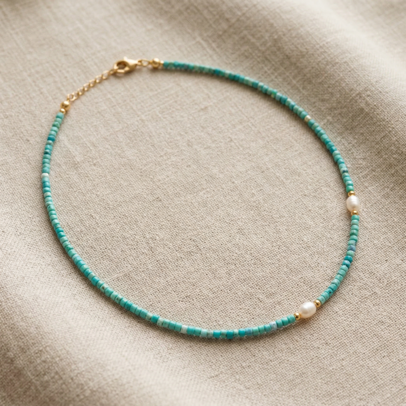 Kugelkette „Azzuro“ mit Süßwasserperlen aus 925er Sterling Silber, goldplattiert